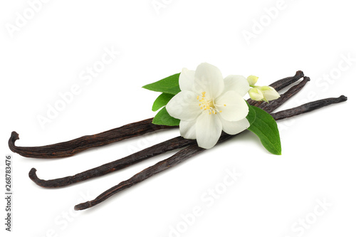 Vanilla sticks with white flower isolated on white background