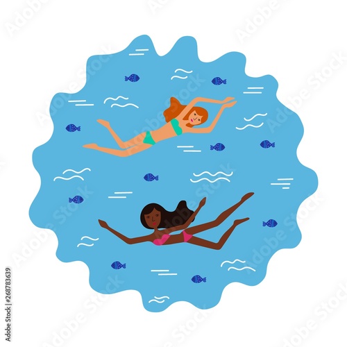 girls swim in the sea or ocean with fishes
