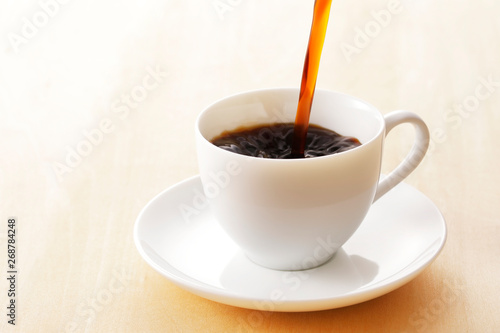                Coffee cup on wooden background