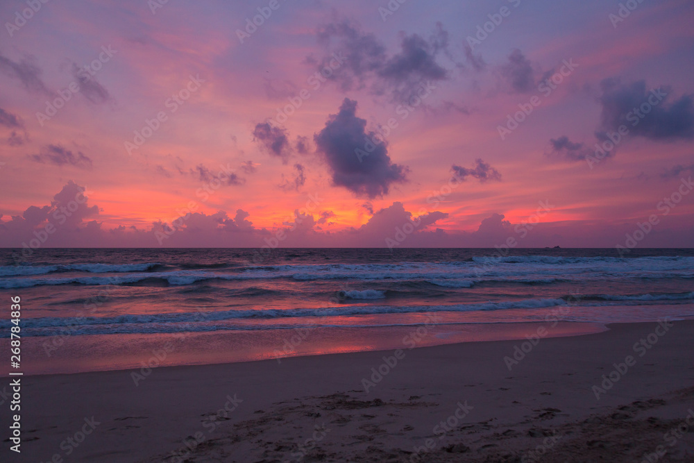 Pink sunset on the beach in Thailand