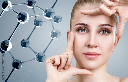 Young woman among glass molecules.