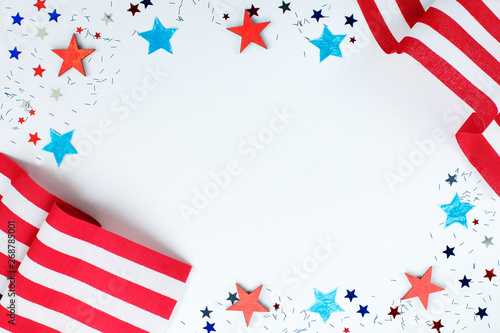 4th of July. Concept for Independence Day with red and blue paper stars confetti and flag in national American colors. Independence day, card,