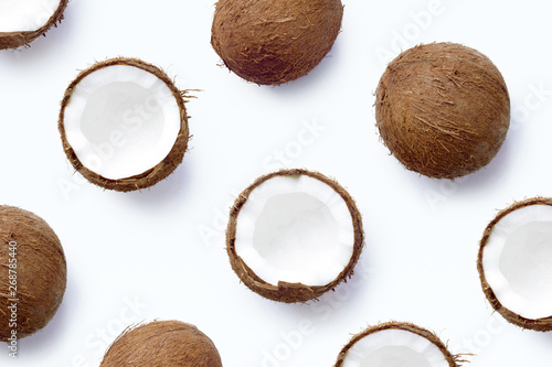 Pattern with ripe coconuts on white background. From top view. Coconut template