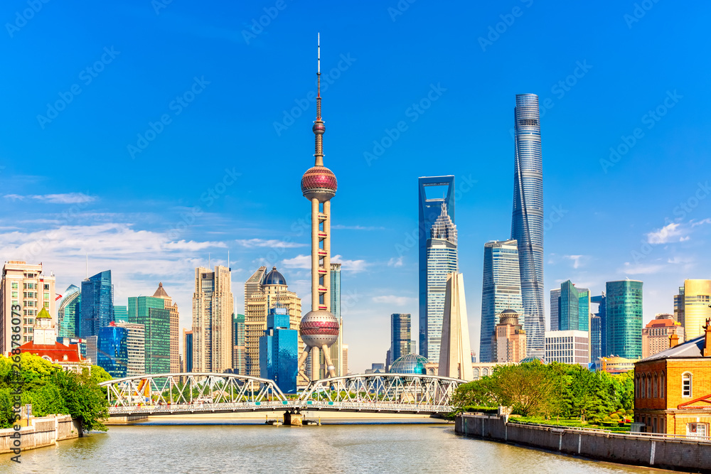 Shanghai pudong skyline with historical Waibaidu bridge, China during summer sunny day