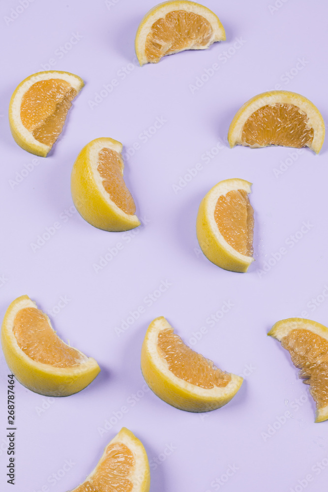 An orange slices on purple background An orange slices on purple background