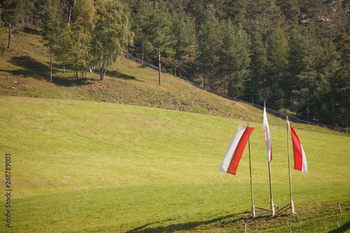 South Tirol flags on the air during the local celebration  Speckfest  in Val di Funes