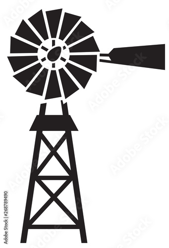 silhouette of a water pumping windmill