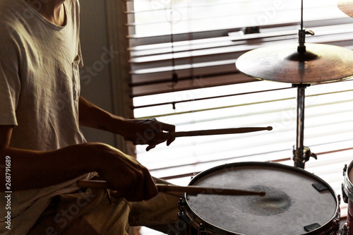 Drummer playing his rudiments on snare drum.