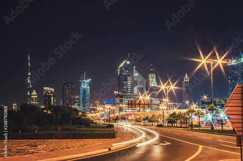 Night landscape with views of the skyscrapers and the Burj Khalifa from the side of the road © volhavasilevich