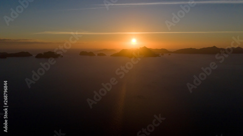 sunset over the sea.Sunset over the sea. Sea pyezhzh with islands during sunset.