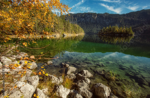 Impressive Autumn landscape The Eibsee Lake in front of the Zugspitze under sunlight. Amazing sunny day on the mountain lake. concept of an ideal resting place. Eibsee lake in Bavaria  Germany