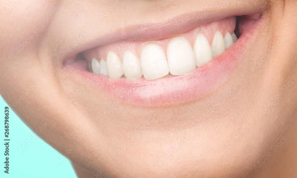 Beautiful wide smile of young fresh woman with great healthy white teeth. Isolated over white background Beautiful wide smile of young fresh woman with great healthy white teeth. Isolated over white background
