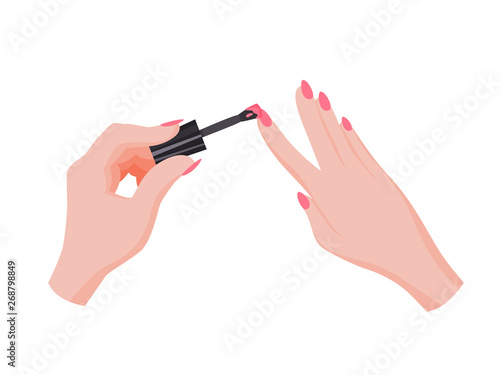 Hand applying nail polish. Making manicure. Female palms