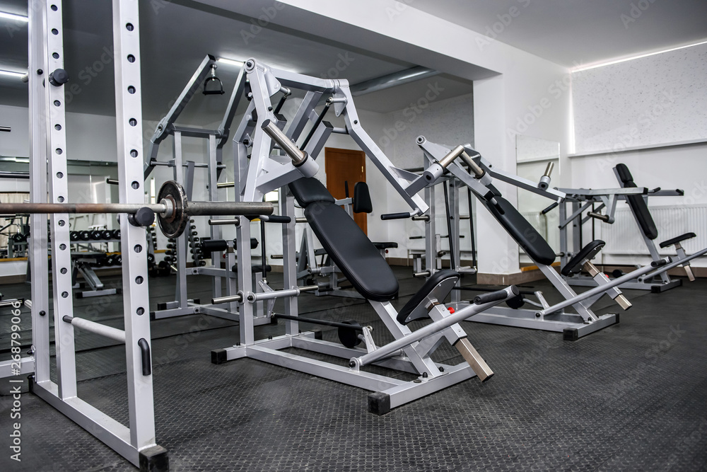 Different sport equipment in gym as background