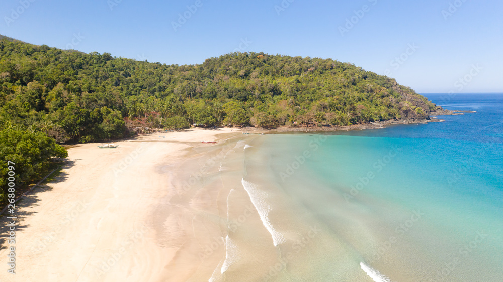Tropical white beach and warm lagoon.Coast of the island with white sand and turquoise lagoon, seascape top view.