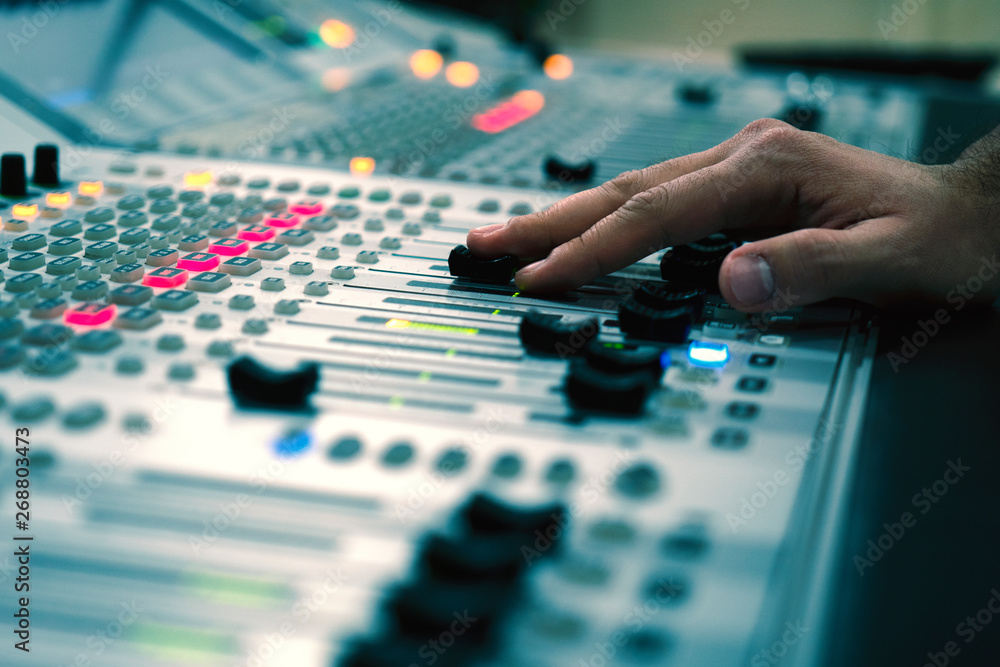 Professional audio mixing console with faders and adjusting knobs - radio / TV broadcasting Professional audio mixing console with faders and adjusting knobs - radio / TV broadcasting