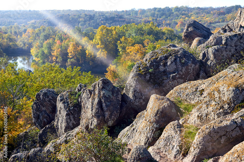 View of stones and river bank on sunny autumn morinig. View from above photo