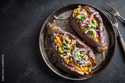 Baked aubergine with bulgur and feta