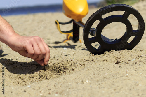 find with metal detector on the beach photo