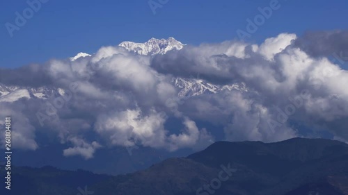 Time lapse close-up cloud moving in front of Kangchenjunga mount at blue sky day, Lockdown.