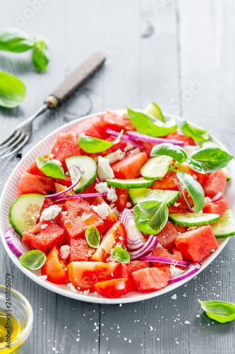 Summer salad with watermelon and salad leaves