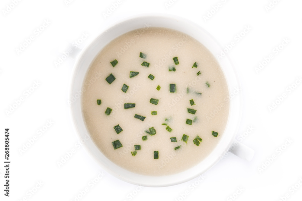 French vichyssoise soup in bowl isolated on white background. Top view French vichyssoise soup in bowl isolated on white background. Top view