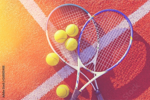 Tennis game. Tennis balls and rackets on  background. © BillionPhotos.com