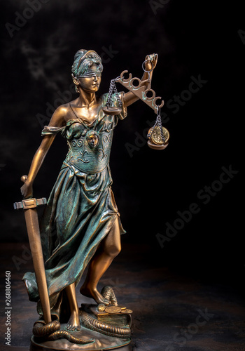 Photography of bronze Themis sculpture, Femida or justice goddess on dark background