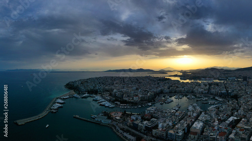Aerial drone bird's eye view of famous port of Piraeus one of the largest in Europe at sunset with beautiful golden colours, Attica, Greece