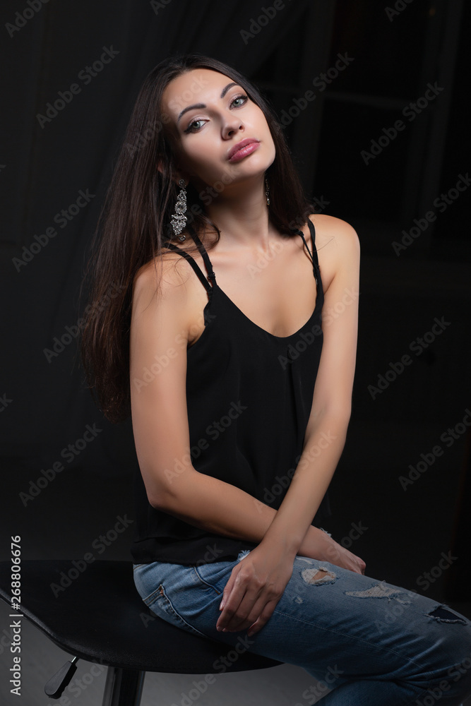 Young beautiful brunette posing in studio. Young beautiful brunette posing in studio.