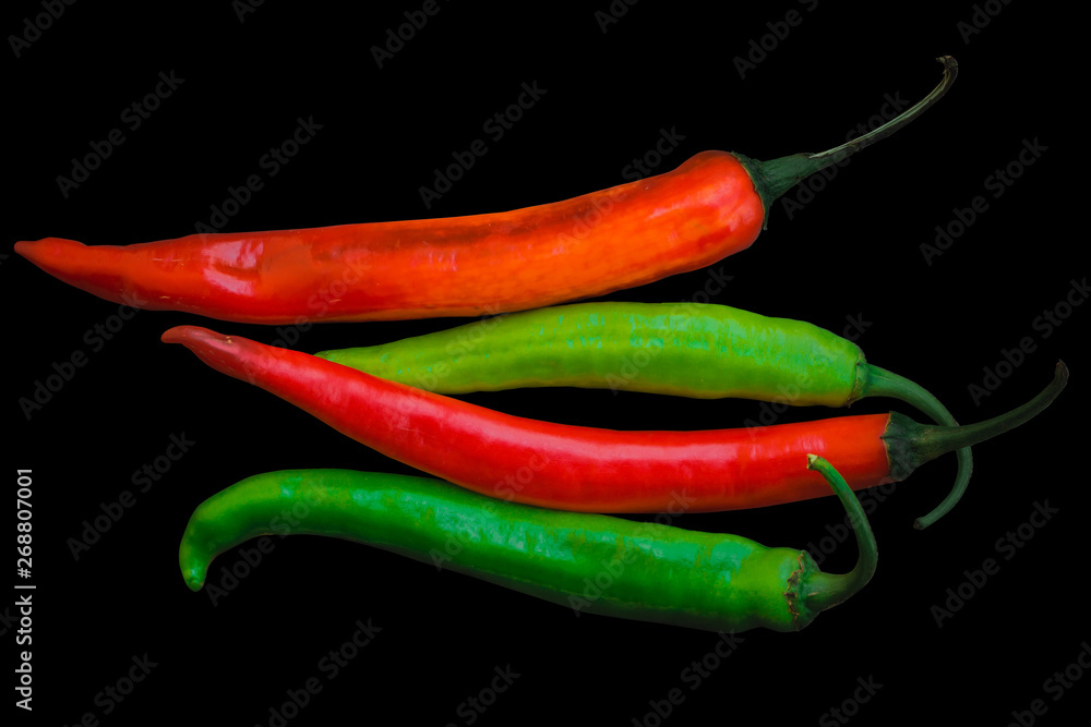 Mix Red and Green Big Chilli peppers Isolated on black background with clipping path Mix Red and Green Big Chilli peppers Isolated on black background with clipping path
