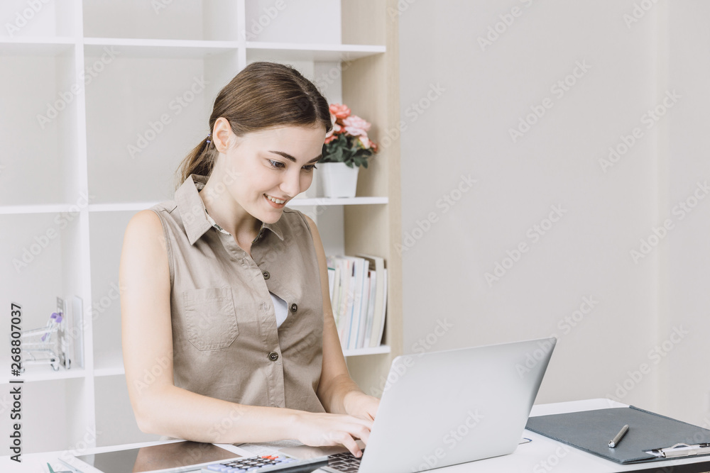Business woman office girl enjoy working on desk with laptop smiling Business woman office girl enjoy working on desk with laptop smiling