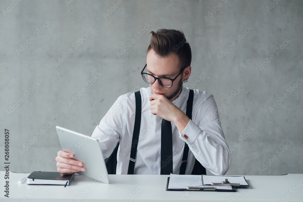 Professional career. Modern company. Head hunter focused on reading CV on tablet. Professional career. Modern company. Head hunter focused on reading CV on tablet.