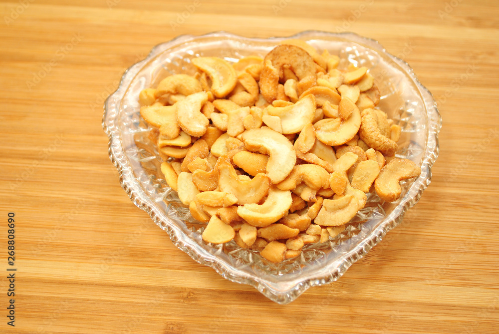 Halved & Pieces of Cashews in a Heart Shaped Bowl Halved & Pieces of Cashews in a Heart Shaped Bowl