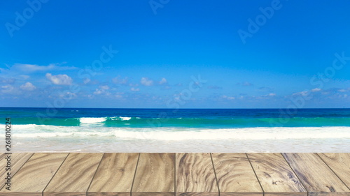 Wood table on beach sea background.