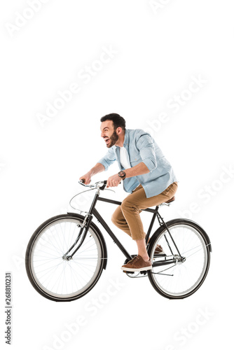 angry bearded man screaming while riding bicycle isolated on white