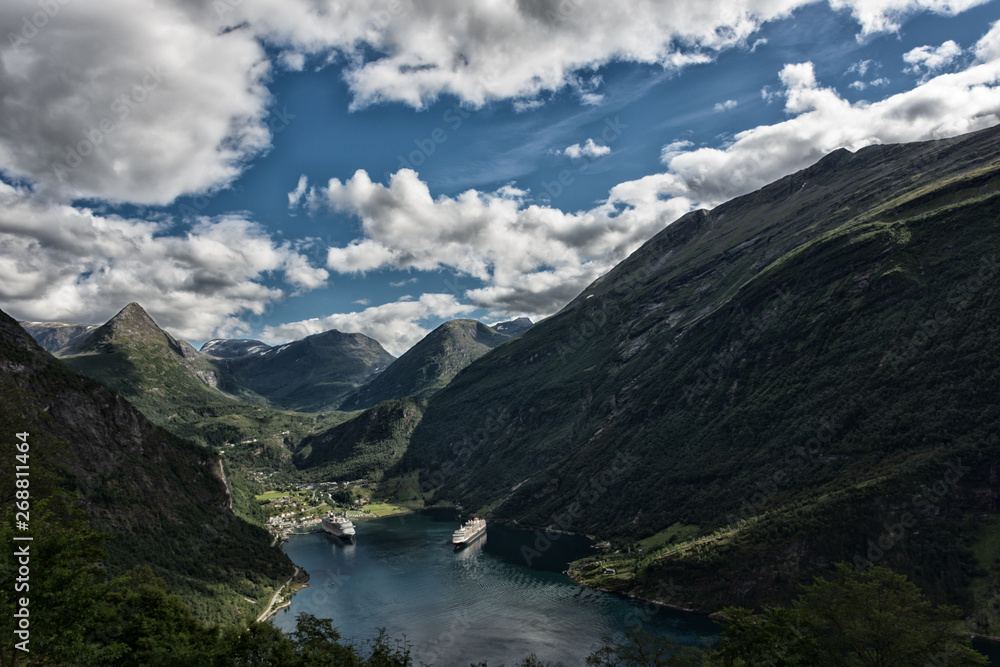 View of Geiranger fjord and Geiranger town, a top ranking tourist destination in Norway View of Geiranger fjord and Geiranger town, a top ranking tourist destination in Norway