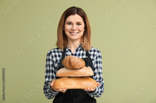 Female baker with bread on ...