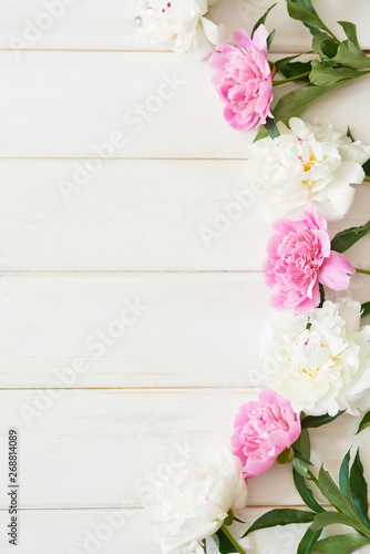 packaging template, layout of peonies on wooden white background © Aleksandr