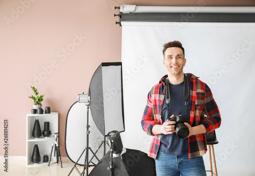 Young male photographer in ...