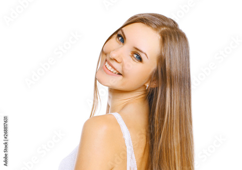 Portrait close-up beautiful young smiling woman with long hair and cute smile on white background