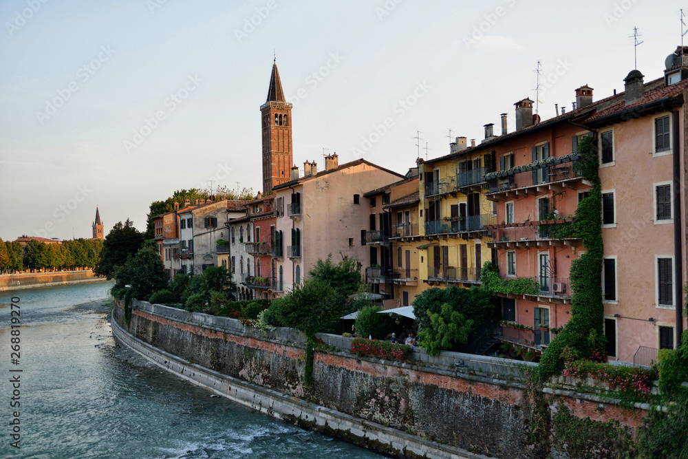 Verona cityscape during late sunset with Adige river and Church Complesso della Cattedrale-Duomo. Verona is located in Veneto, Italy,