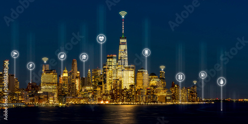 Canvas Print Beautiful scenic night view of new york, manhattan, usa in smart city service icon, internet of things, network technology concept