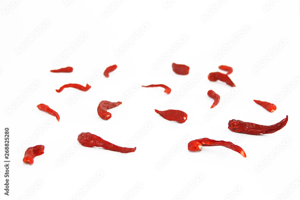 pods of red dried hot bitter edible pepper on a white background pods of red dried hot bitter edible pepper on a white background