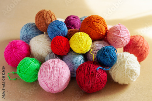 A bunch of colorful yarn balls.