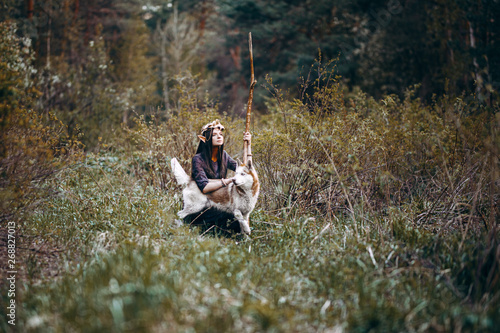 beautiful elf woman fabulous, fairy forest, famtasy young woman with long ears, long dark hair golden wreath crown on head with red dog like wolf