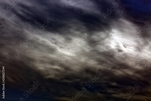 Gray rainy sky with big clouds. Nature background.