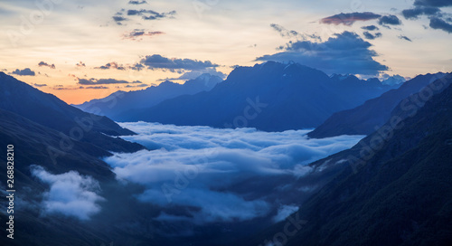 Dawn in the Caucasus Mountains, above the clouds, panorama landscape