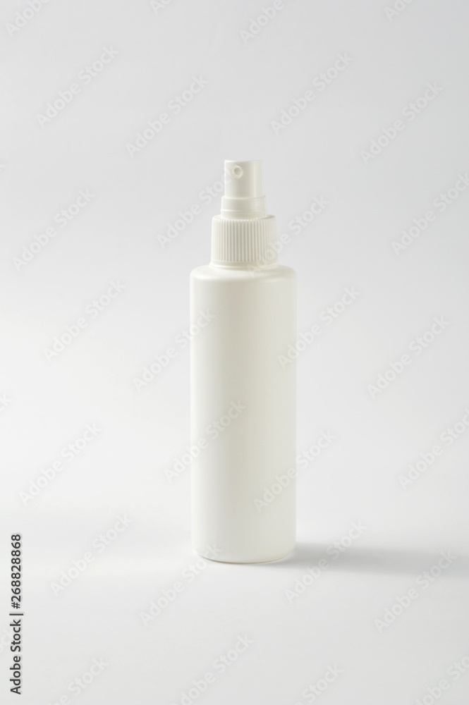 White plastic spray bottle isolated on white White plastic spray bottle isolated on white