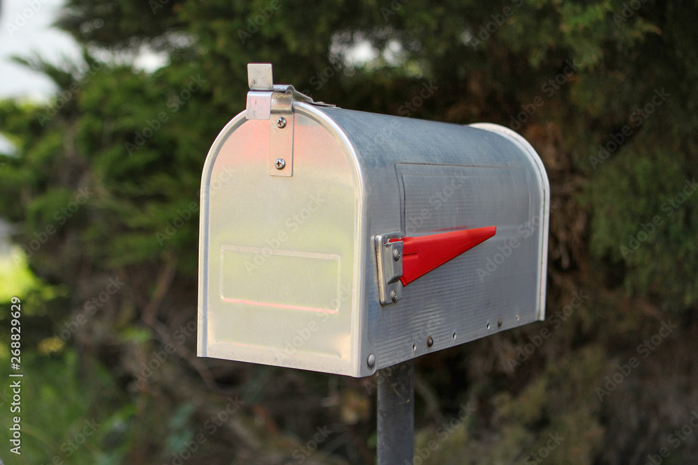 traditional mailbox stands in front of the trees, communication and message concept traditional mailbox stands in front of the trees, communication and message concept